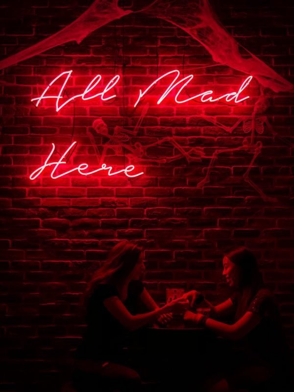 all mad here neon sign